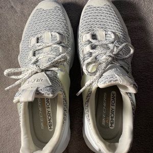 Sketchers, athletic sneakers.